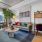 open living room, dining and study areas with city views