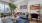 open living room, dining and study areas with city views