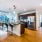 floor-to-ceiling windows naturally brighten spacious kitchen and open dining areas