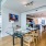open dining and kitchen spaces with ample lighting