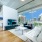 concrete ceilings and floor-to-ceiling windows in bright living room