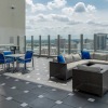rooftop terrace with city views and grill area